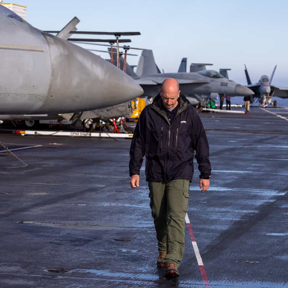author chester hull walks towards the camera